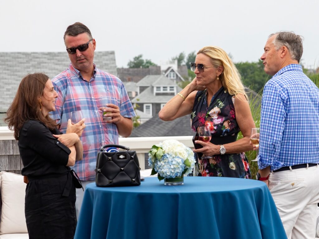 Exclusive Yachts - Group of people speaking outside at Nantucket