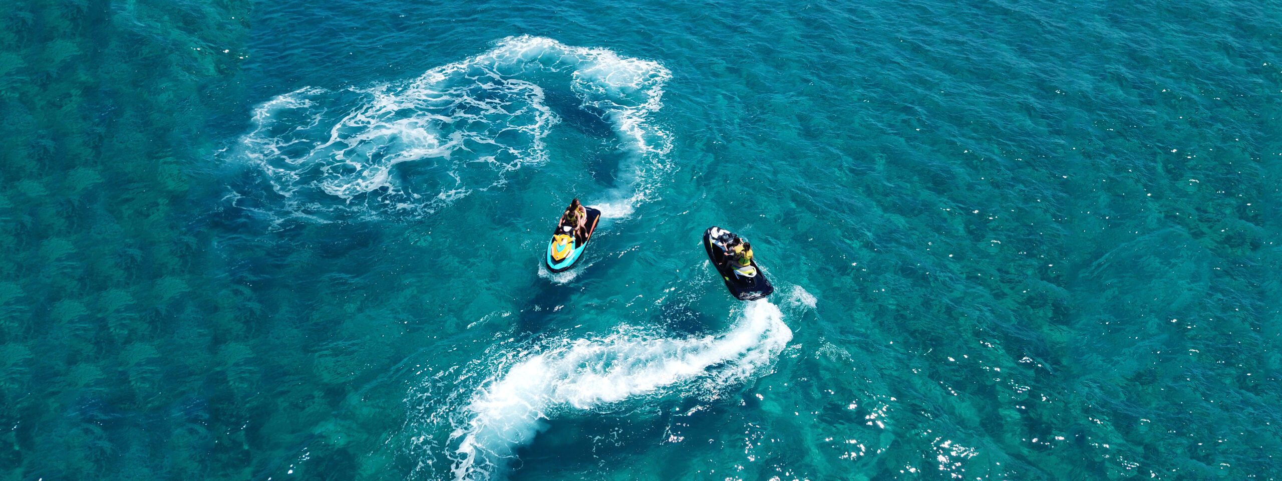 Exclusive Yachts - Aerial drone ultra wide photo of jet ski watercraft couple cruis