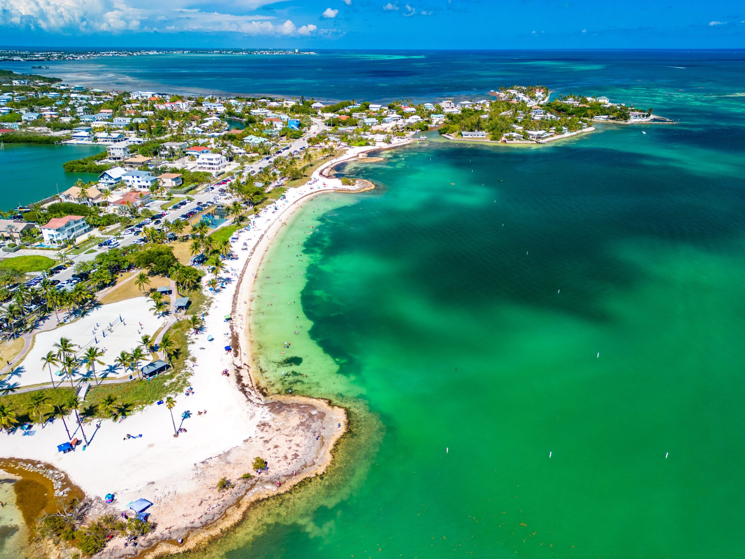 Exclusive Yachts - Sombrero Beach with palm trees on the Florida Keys, Marathon, Florida, USA.