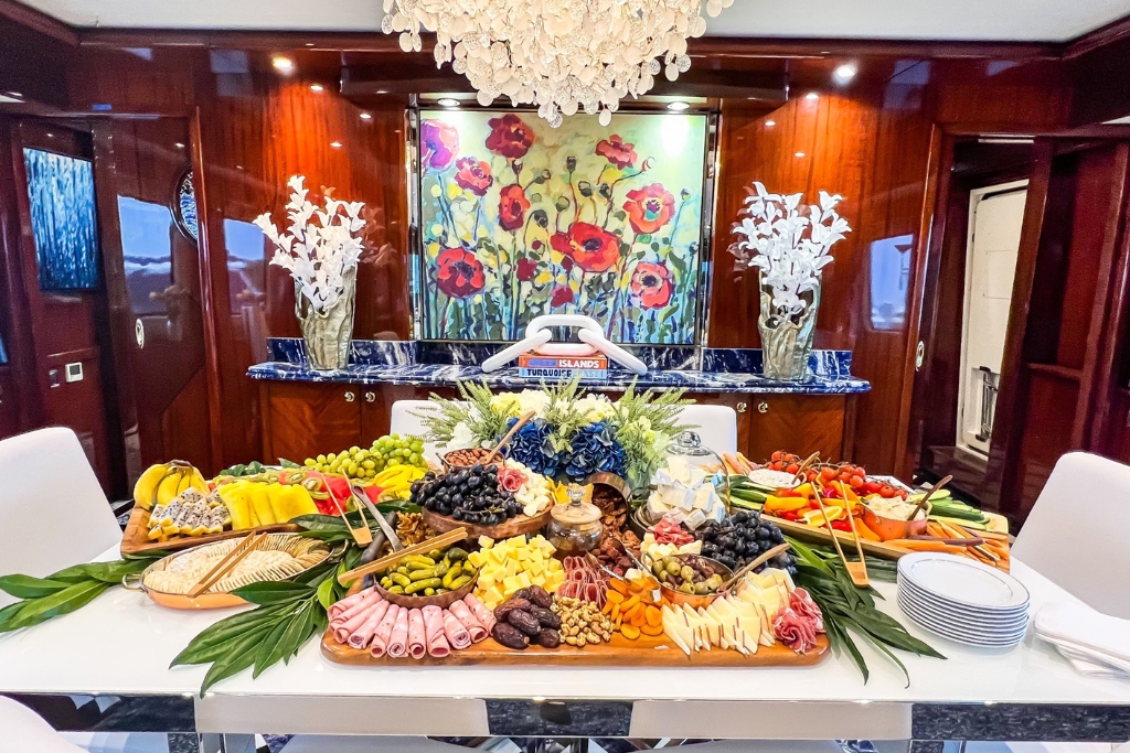 Exclusive Yachts - A lavish spread of gourmet delicacies set against a backdrop of opulent interior design on the MY Star Sapphire.