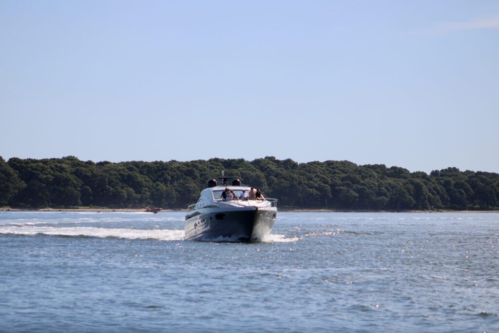 Shelter Island Yachting - Exclusive Yachts - a speed boat on a leisurely drive through Long Island Sound