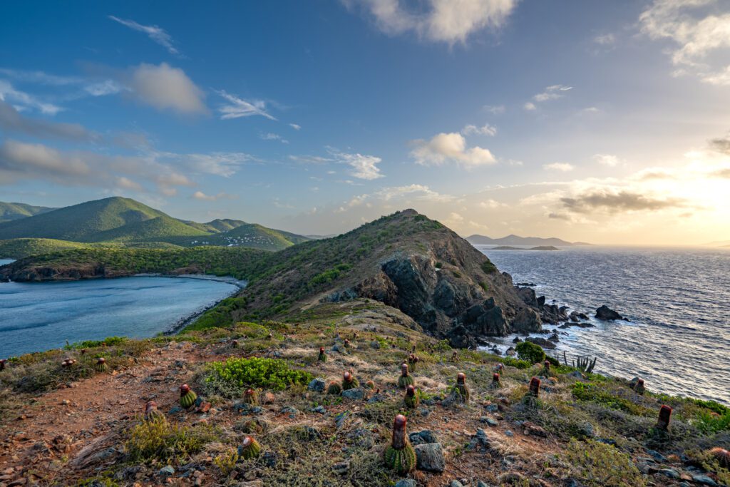 Exclusive Yachts - Vibrant sunrise from Ram Head Peak overlooking the beautiful secluded Salt Pond Beach on the tropical Caribbean island of St. John in the US Virgin Islands